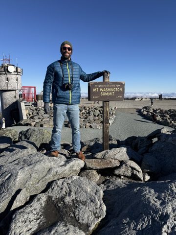 Me at the summit sign